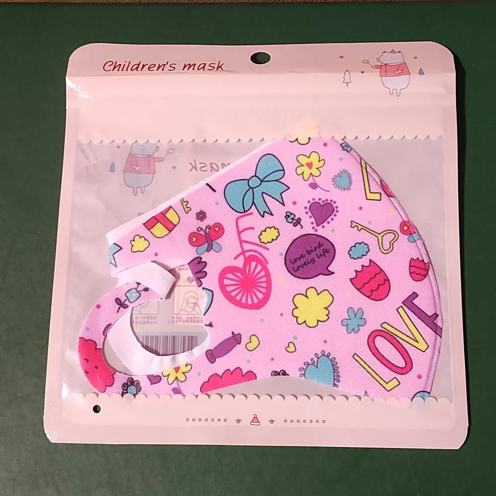 Children's re Usable face mask new in package never opened